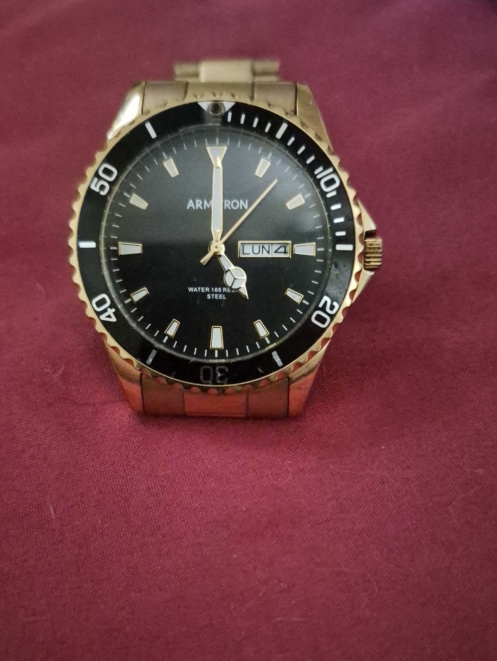 Armitron Gold-Tone Watch with Black Dial and Day-Date
